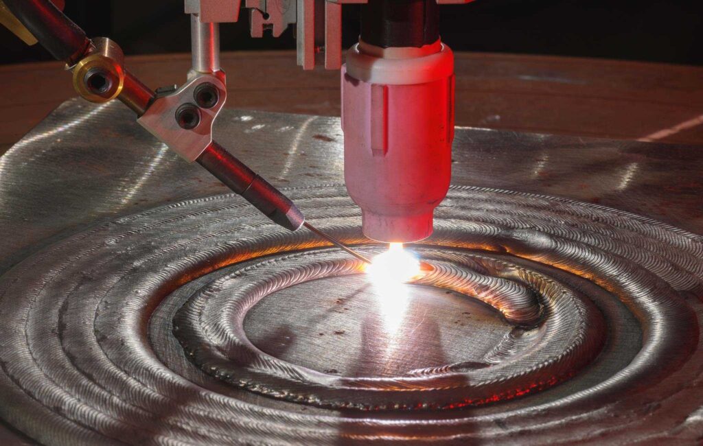 جوشکاری قوسی چیست؟ - تعریف و انواع فرایند 5 ایران بور hot wire tig welding 20109671066 4c4585c566 o parallax 2048x1299 1 ایران بور جوشکاری قوسی چیست؟ - تعریف و انواع فرایند